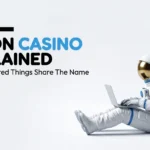 An astronaut in a white and blue suit with a gold visor is sitting on the floor, using a silver laptop, next to text that